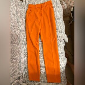 H&M orange skinny dress pants.